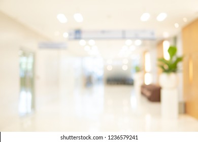 Abstract Blur Luxury Hospital Corridor. Blur Clinic Interior Background With Defocused Effect. Healthcare And Medical Concept