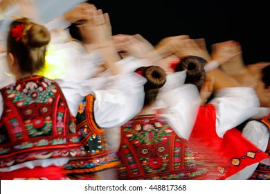 Abstract Blur Moving With Amazing Dance. Young Romanian Dancers In Traditional Costume.