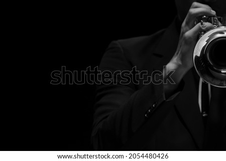 Abstract, blur musician playing the Trumpet black and white