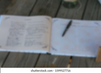 Abstract Blur Of Open Guest Book On Wedding.