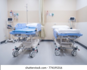 Abstract blur, patient's bed and diagnostic equipment in the hospital emergency department.