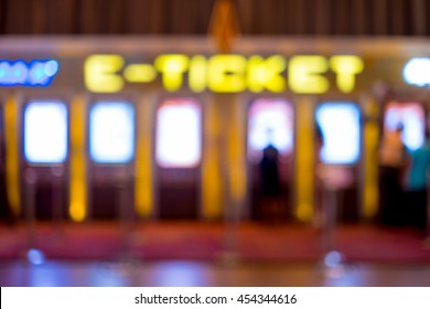 Abstract Blur People Buying Movie Ticket From E-ticket Selling Machine In Front Of The Theater