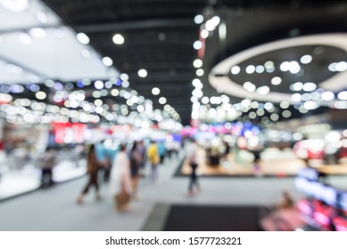 Abstract blur people in exhibition hall event trade show expo background. Large international exhibition, convention center, MICE business industry concept