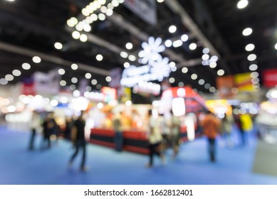 Abstract blur people in exhibition hall event trade show expo background. Large international exhibition, convention center, Business marketing and MICE industry concept.