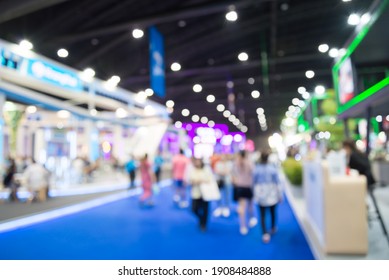 Abstract blur people in exhibition hall event trade show expo background. Large international exhibition, convention center, business marketing and event fair organizer concept.