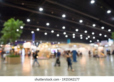 Abstract blur people in exhibition hall event trade show expo background. Large international exhibition, convention center, business marketing and event fair organizer concept. - Shutterstock ID 1925342177