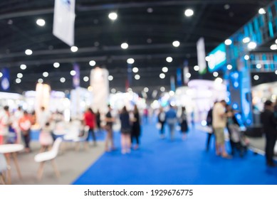 Abstract blur people in exhibition hall event trade show expo background. Large international exhibition, convention center, business marketing and event fair organizer concept. - Shutterstock ID 1929676775