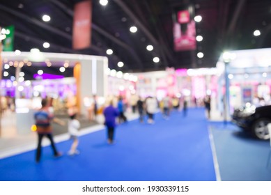 Abstract blur people in exhibition hall event trade show expo background. Large international exhibition, convention center, business marketing and event fair organizer concept.