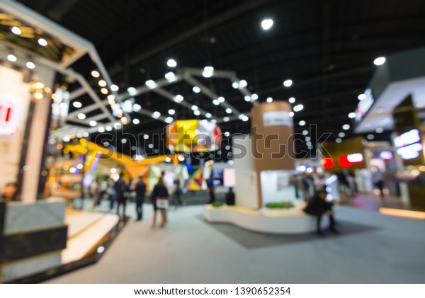 Abstract blur people in exhibition hall\
event trade show expo background. Large international exhibition,\
convention center, MICE industry business\
concept
