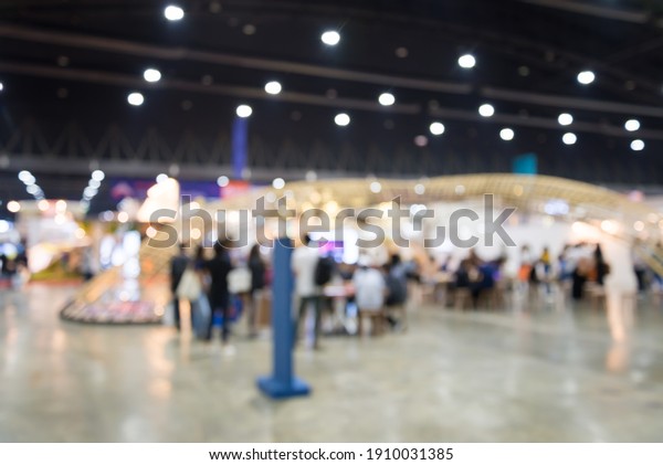 Abstract blur\
people in exhibition hall event trade show expo background. Large\
international exhibition, convention center, business marketing and\
event fair organizer\
concept.