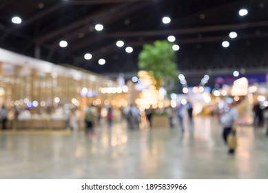 Abstract blur people in exhibition trade show expo background. Business finance and event concept.