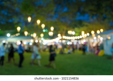 Abstract blur people in night festival city park bokeh background