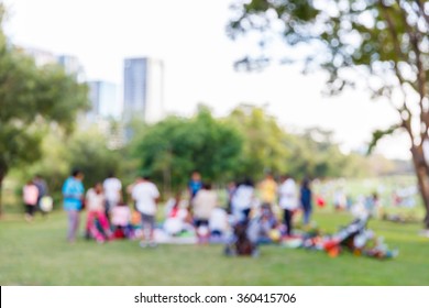 Abstract Blur People Picnic In Public Park With Family Or Friends, Urban Leisure Lifestyle