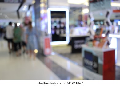 Abstract blur people in shopping mall and department store interior for background with bokeh light. - Shutterstock ID 744961867