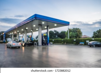 Abstract blur photo of car refueling on gas station at sunset. Pump gasoline gauge oil in the evening. This photo can be used for automotive service industry or unleaded transportation concept