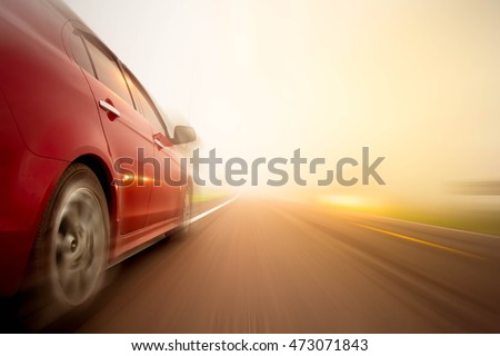  abstract blur Red car on the road at sunset light