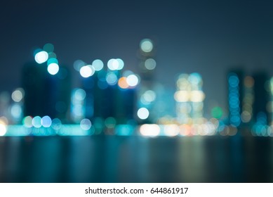 Abstract Blur Seaside Night Cityscape With Reflection Background