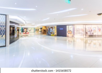 Abstract blur shopping mall of department store interior for bac