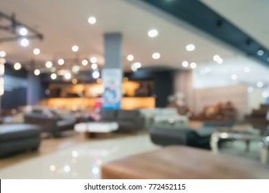 Abstract Blur Sofa In Furniture Store Shop Interior With Bokeh Light Background For Montage Product Display