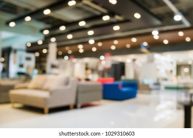 Abstract blur sofa in home decor furniture showroom store interior with bokeh light background for montage product display