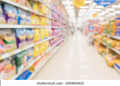 Abstract Blur Supermarket Discount Store Aisle And Pet Food Product Shelves Interior Defocused Background