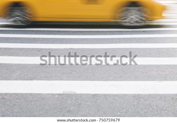 Abstract blur of urban street scene with a\
yellow taxi cab in New York, United\
States