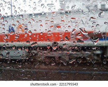 Abstract Blur Of Water Drops From Train Window, On Train Background