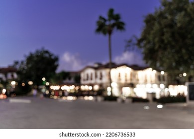 Abstract Blured Defocused Image Of European Cosy Street At Night With Beautiful Bokeh Lights. Great Backdrop For Your Design. Travel Concept. Copy Space.