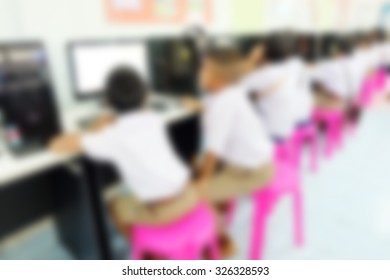 Abstract blurred background. Blur computer room in school. Network communication. Students learning computer.