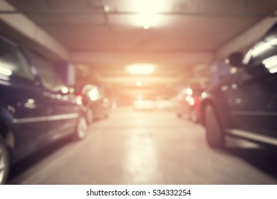 Abstract blurred background of car in parking lot with perspective view