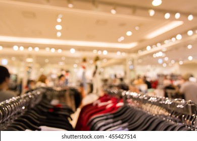 Abstract Blurred Background Of Department Store Interior Cloth Fashion Zone, Concept Business Fashion And Marketing Background.