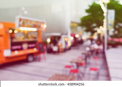 Abstract blurred background of food trucks.
