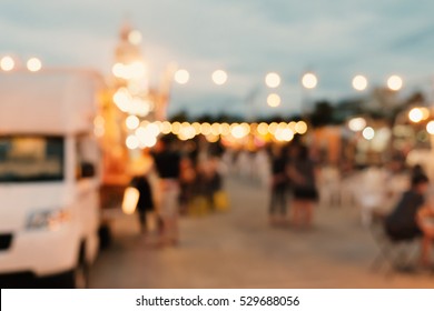 Abstract Blurred Background Of Food Trucks.