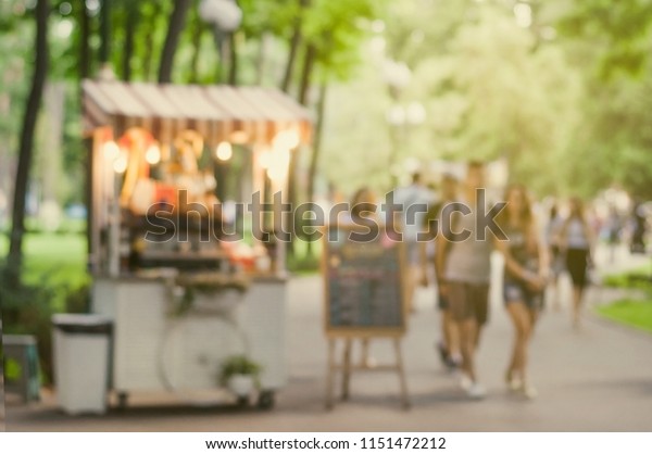 Abstract blurred background of food trucks. Street\
and Fast Food