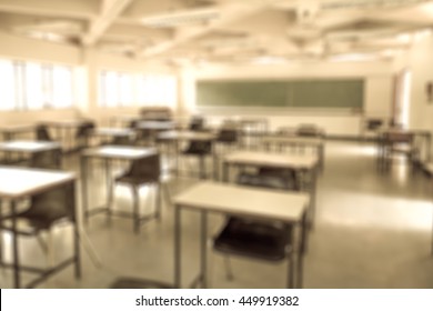 Abstract Blurred Background Image Of Empty Classroom Without Student After School; Blurry View Of Exam Hall With Chairs And Tables In Room At The End Of Semester Vintage Tone