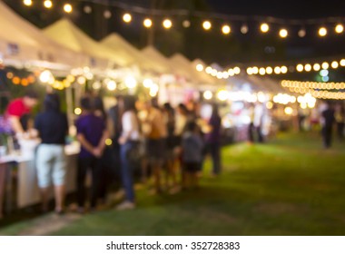 Abstract blurred background of people shopping at night festival - Shutterstock ID 352728383