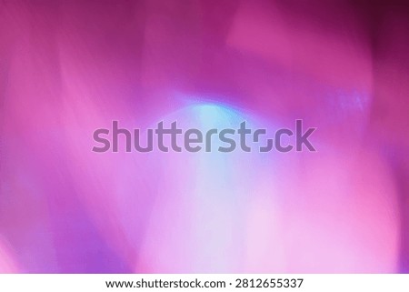 Abstract blurred background with a pink and purple color gradient. Dreamy out of focus petals with a bright highlight and light leak, creating an ethereal floral texture for romantic, creative designs