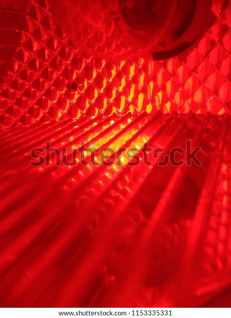 Abstract\
Blurred background of the Red Car Lamp. The Glass texture. Abstract\
out of focus lights coming from the Red Car Lamp. Abstract\
background of Red color. Close up. Macro.\
