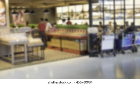 Abstract Blurred Background Of Restaurant Or Bakery Shop With People In The Airport.