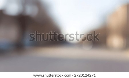 Abstract blurred background with soft bokeh, featuring muted shades of beige and light.