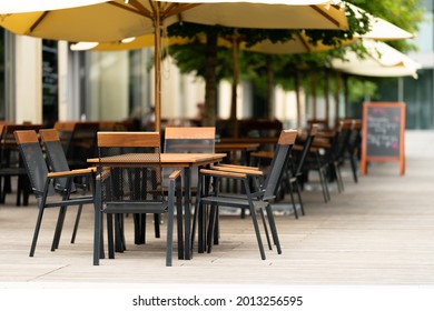 Abstract Blurred Background Street Cafe Or Restaurant In The City. No People, Empty, Summer Restaurant Quarantine. Covid, Restriction In Prague. Angry People.