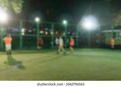 Abstract Blurred Background Of Street Football Court With Players