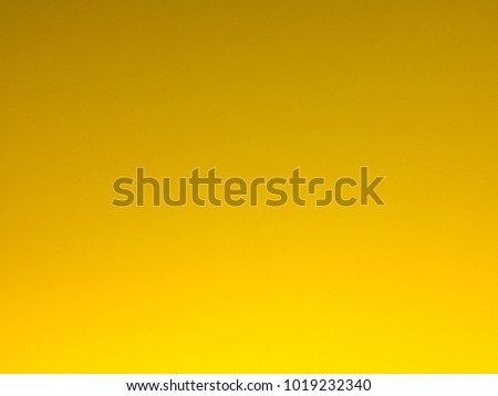 Abstract blurred background yellow color with smooth gradient for banner header or sidebar graphic.Creative by mobile phone camera.