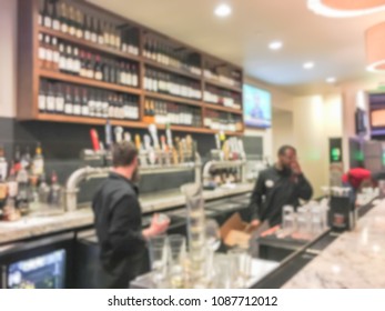 Abstract blurred of bartender serving craft beer at tab counter in Texas, USA.