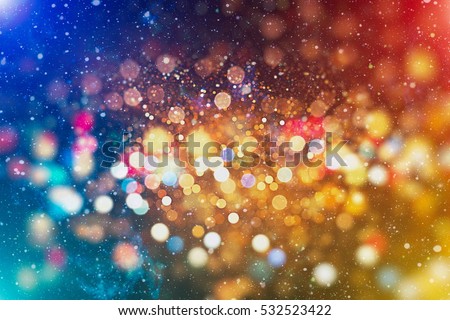 abstract blurred of blue and silver glittering shine bulbs lights background:blur of Christmas wallpaper decorations concept.xmas holiday festival backdrop:sparkle circle lit celebrations display .
