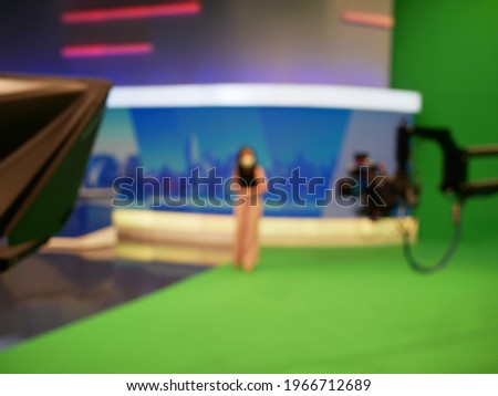abstract blurred of broadcast camera in studio at TV station.