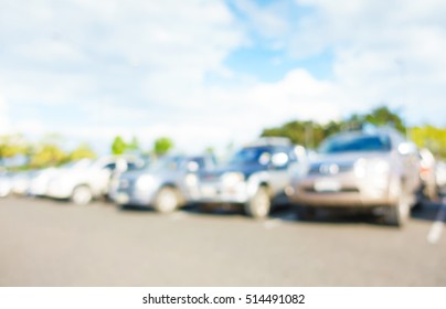 Abstract blurred car in outdoor parking lot at daytime in the city.