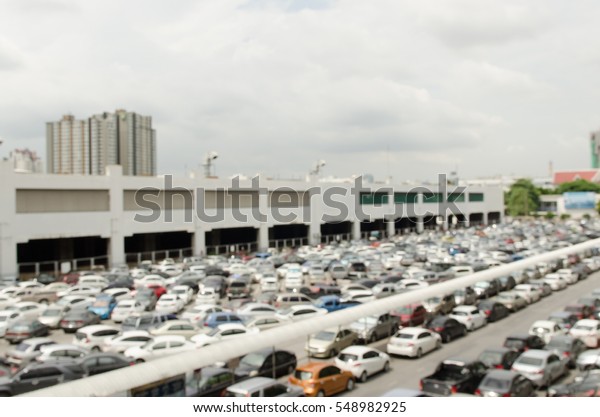 Abstract blurred of cars park at outdoor car\
parking, high angle\
view.