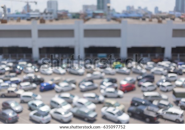 Abstract\
blurred of cars park at outdoor car\
parking.