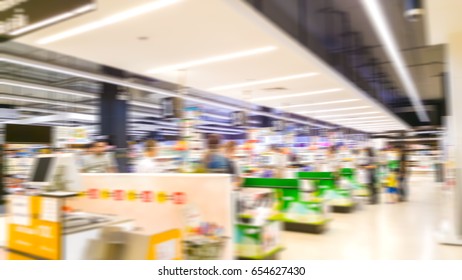 Abstract Blurred Cashier Area With People Waiting Checkout In Supermarket Thailand